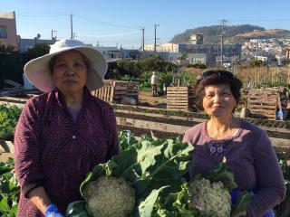 Two women with produce.
