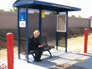 New bus shelter with customer.