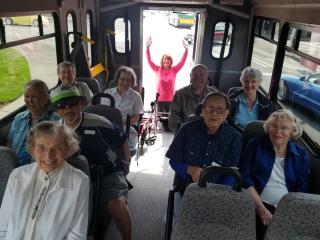 Group in bus going to event.