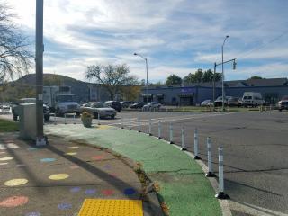 Intersection with traffic calming, paint, and delineators.