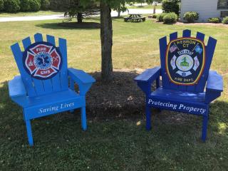 Two artistic Adirondack chairs.