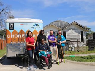 Volunteers with Chore Corps Trailer and tools.