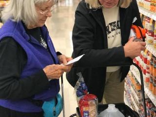 Helping older adult shop.