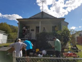 Volunteers fixing porch.