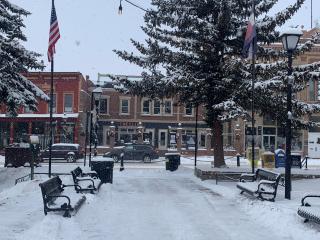 New benches in town square in winter.
