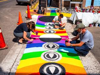 Group painting colorful crosswalk.
