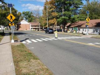 New automatic crossing signal at a crosswalk.