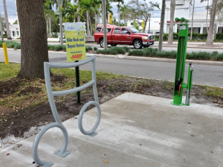 Musical note bike rack and fix it station at park amphitheater.