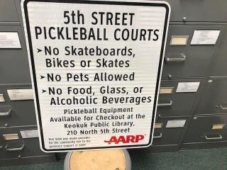 Sign with Pickleball Court rules.