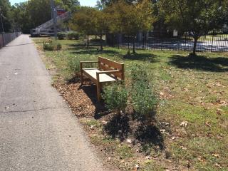 New bench along trail and landscaping.