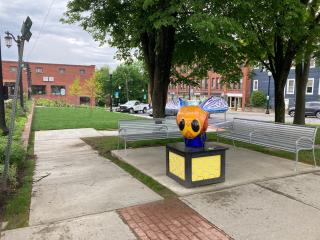 Artistic bee sculpture and benches.