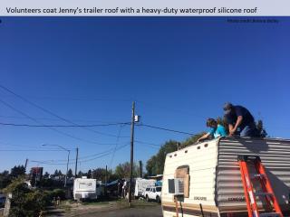 Volunteers working on trailer roof.