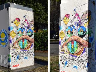 Artistic vinyl wrap promoting East Coast Greenway on utility boxes.