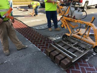 Installing new brick crosswalk.
