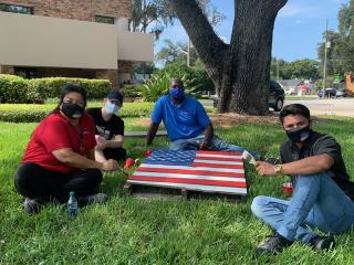 Group painting pallet like the United State of America flag.