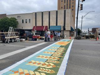 New artistic crosswalk with wheat theme and painters.