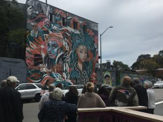 Walking tour viewing mural.