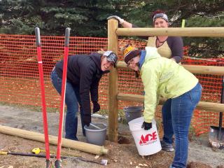 Volunteers installing fence.