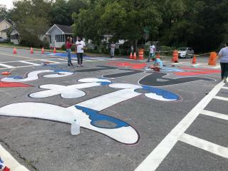 Group painting intersection and crosswalks.