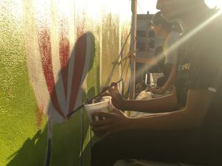 Painting the mural.
