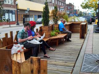 People eating at parklet.