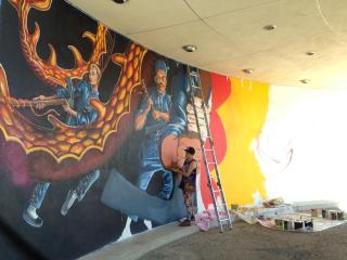 Painting the mural in underpass.
