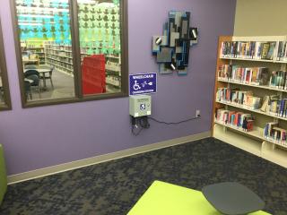 Charging station for electric wheelchairs at library.
