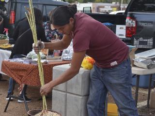 Making parched corn at event.