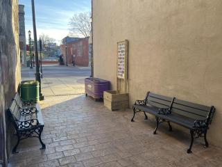 Alley with new benches, planters, and butterfly tile art.