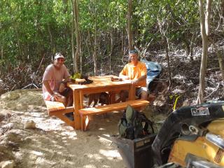 Installing table and bench along trail