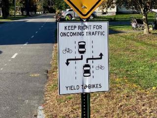Sign explaining new bike lanes.