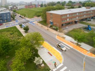 Overhead view of artistic crosswalks and lane reduction.
