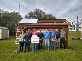 Volunteers with partially completed pavilion.
