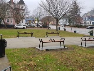 Two new trash cans and four benches.