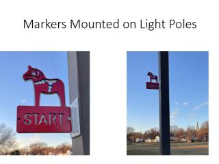 Mile markers installed on light poles.