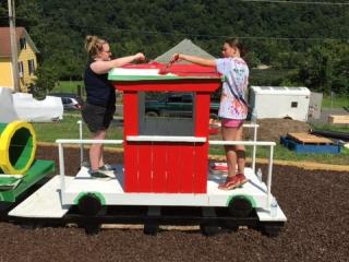 Painting caboose for playground.