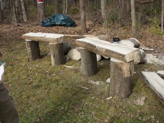 Wood benches made of slit logs.
