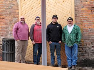Four city employees who built pocket park.