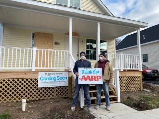 New Habitat for Humanity home with AARP thank you sign