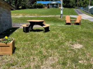 Adirondack chairs, table and planter.
