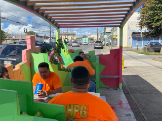 People eating in parklet.