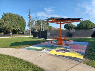 Solar charging table in community park.