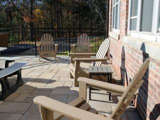 Adirondack chairs on patio.