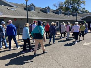Large group of older adults walking.