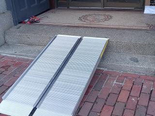 Metal wheelchair ramp to business.