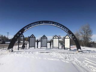 Memorial arch and panels in the snow.