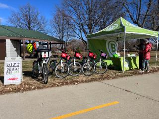 Bike share pop-up tent and available bicycles.