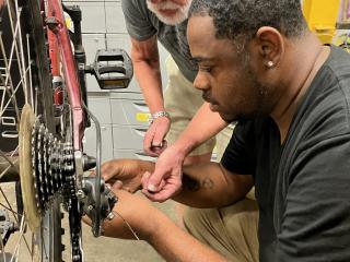 Repairing a bike chain.
