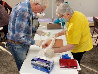 Older adults learning first aid skills.