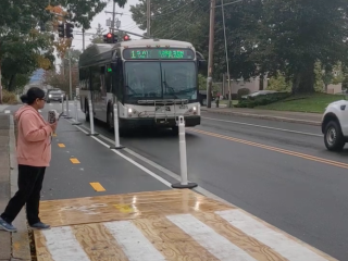 Temporary platform over bike lane, to access a transit bus